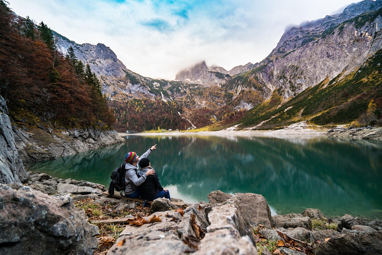 couple, lake, mountains, point, pointing
